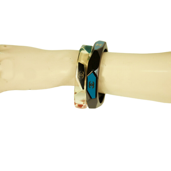 CHANEL CC Logo Bangle Bracelet In Black Resin with teal background Geometric cuff
