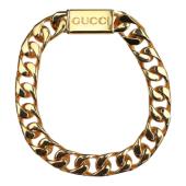 GUCCI Script logo-engraved gold-tone metal thick chain bracelet retails at 550$