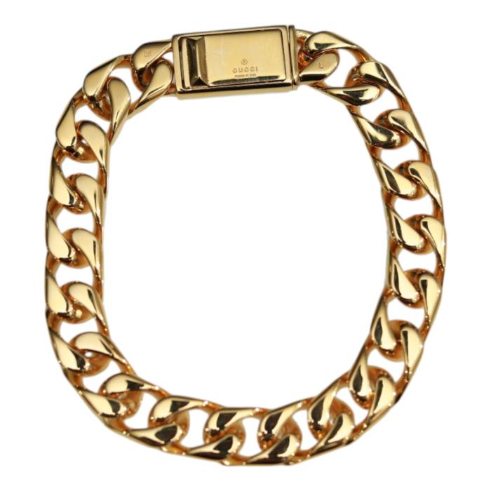 GUCCI Script logo-engraved gold-tone metal thick chain bracelet retails at 550$
